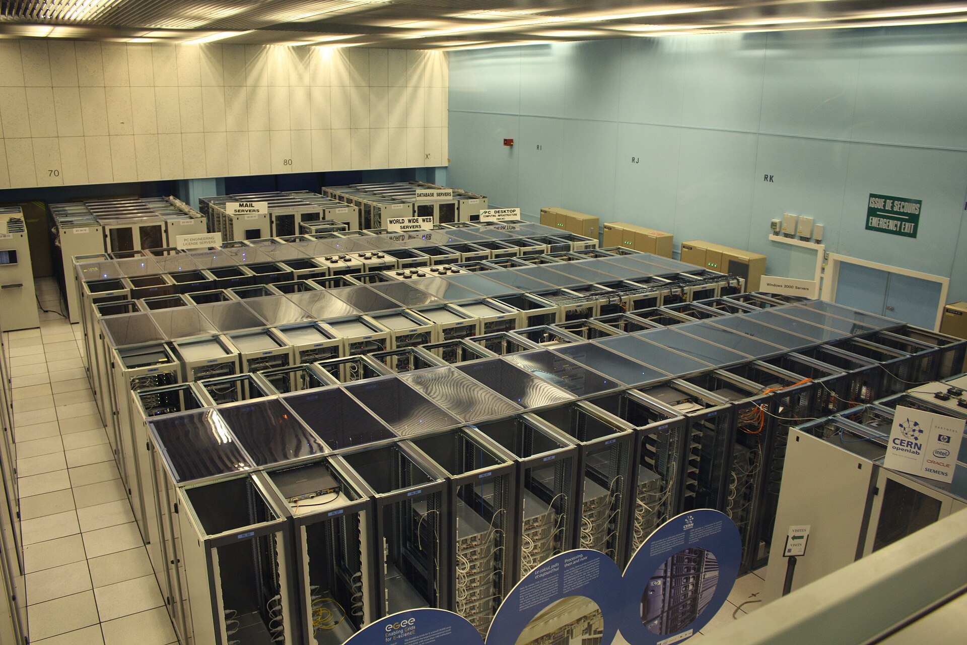 Rows of server racks and cabling in a data center floor